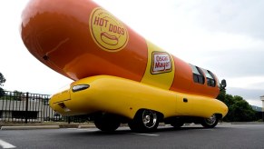 An Oscar Mayer Wienermobile shows off its hot dog shape and bun base while on tour.