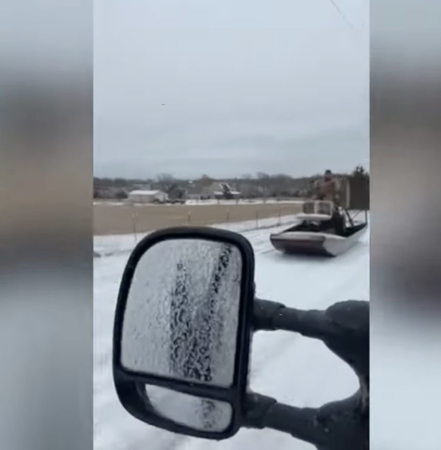 Texas man driving his airboat on the road during an ice storm