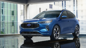 A blue 2023 Ford Escape ST-Line Elite compact SUV model in a parking garage