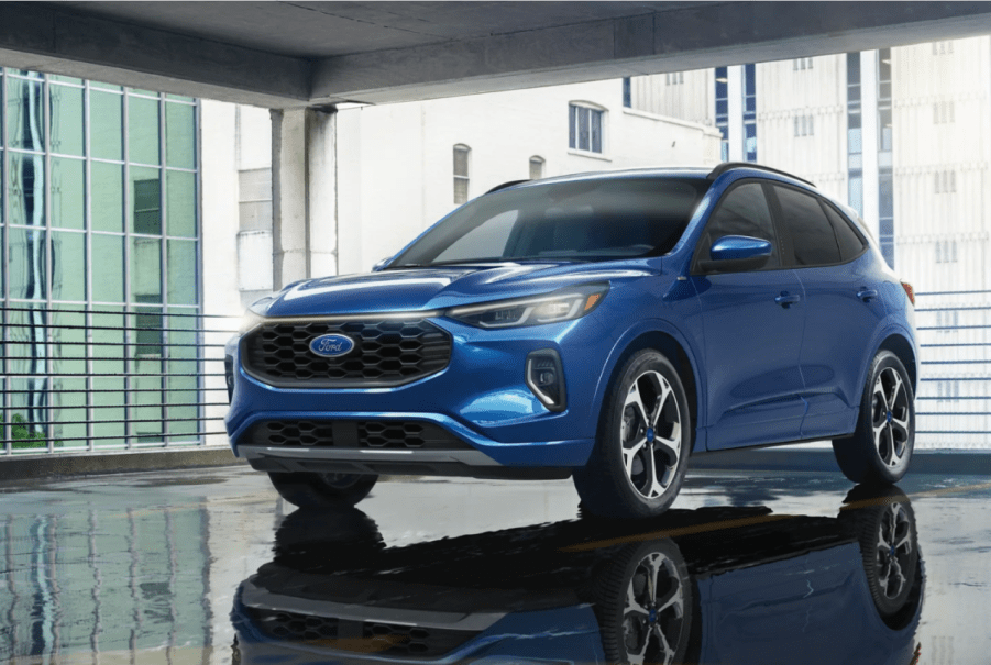 A blue 2023 Ford Escape ST-Line Elite compact SUV model in a parking garage