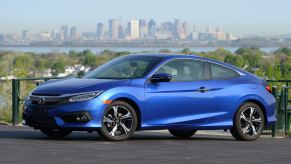 A blue 2016 Honda Civic Coupe