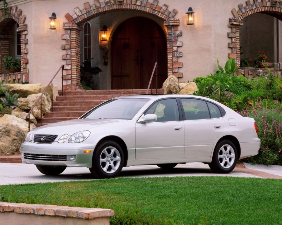 A gray 2001 Lexus GS 300 executive car/luxury sedan model parked outside a luxury home/villa