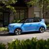 A light blue 2023 Kia Soul subcompact SUV/CUV model parked under tree shade