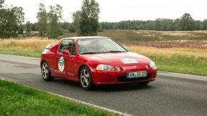 A red Honda CR-X Del Sol in the district of Undeloh in the Lüneburg Heath