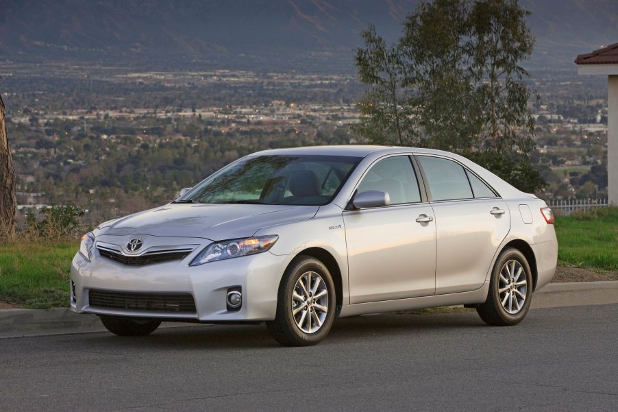 A silver-gray 2010-2011 Toyota Camry Hybrid midsize sedan production model