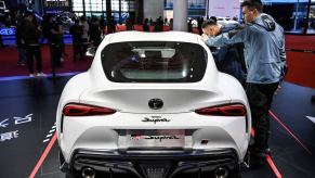 White Toyota Supra at an auto show.