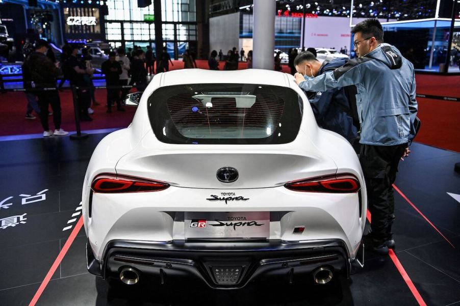 White Toyota Supra at an auto show.