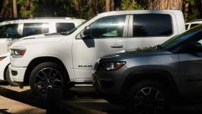 A group of trucks and SUVs parked outdoors.