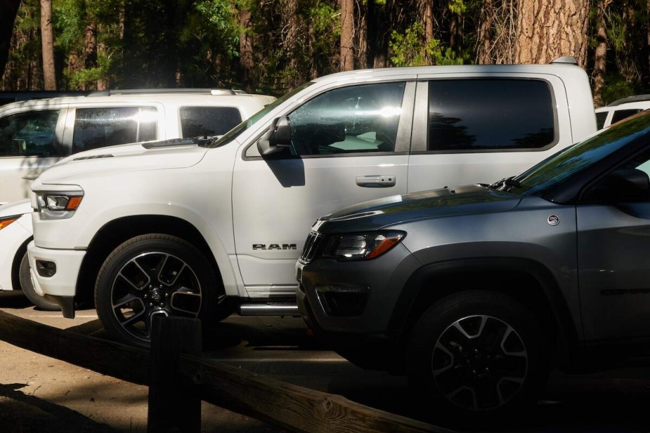 A group of trucks and SUVs parked outdoors. 