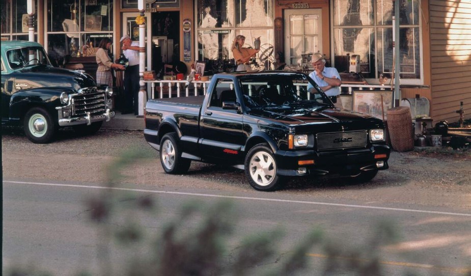 A black 1991 GMC Syclone parked outdoors. 