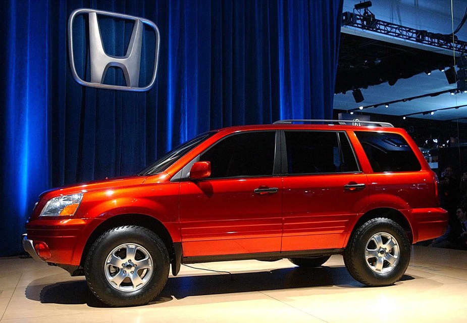 A Red 2003 Honda Pilot 