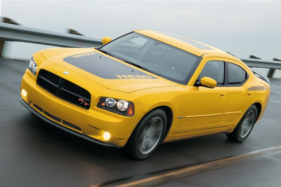 A yellow and black used 2006 Dodge Charger Daytona blasts across a banked section of track.