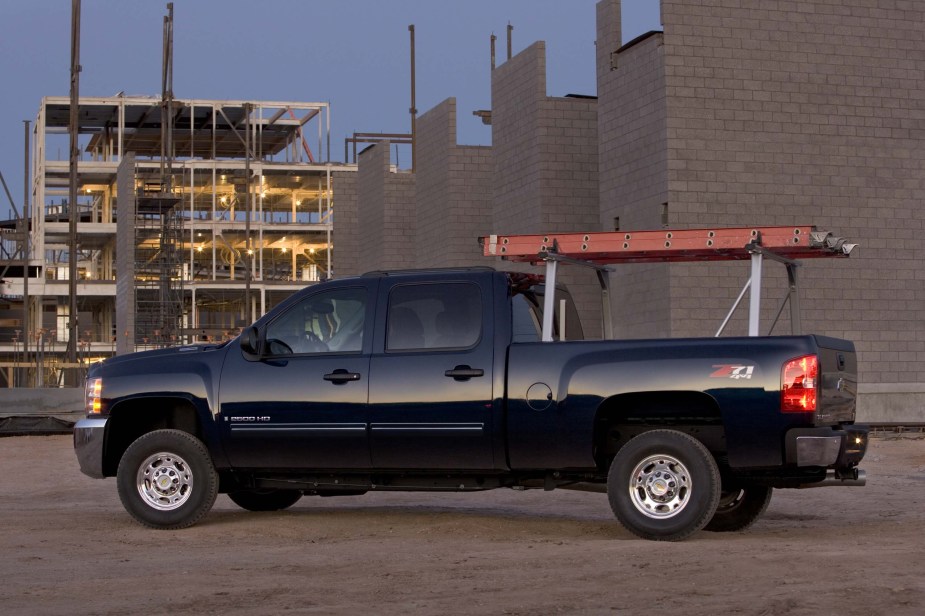 A black Chevrolet Silverado with a ladder rack.