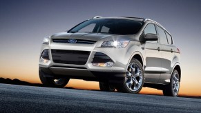 A silver 2014 Ford Escape shows off its LED lights and front-end styling.