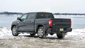 A 2014 Toyota Tundra sits in front of a lake.