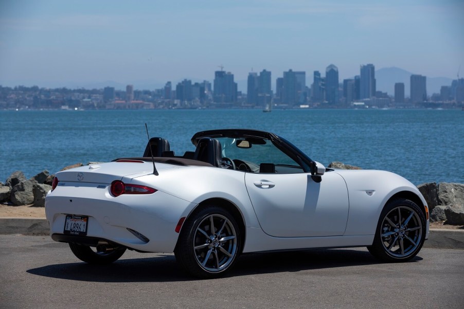 A white 2023 Mazda MX-5 Miata shows off its non-RF convertible top.