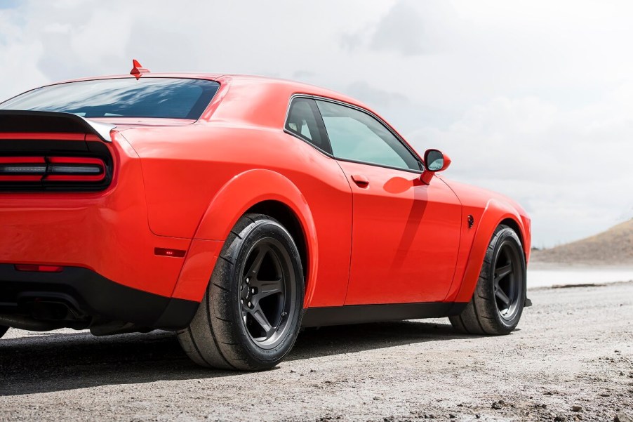 An orange Dodge Challenger SRT Hellcat Redeye parks on salt flats.