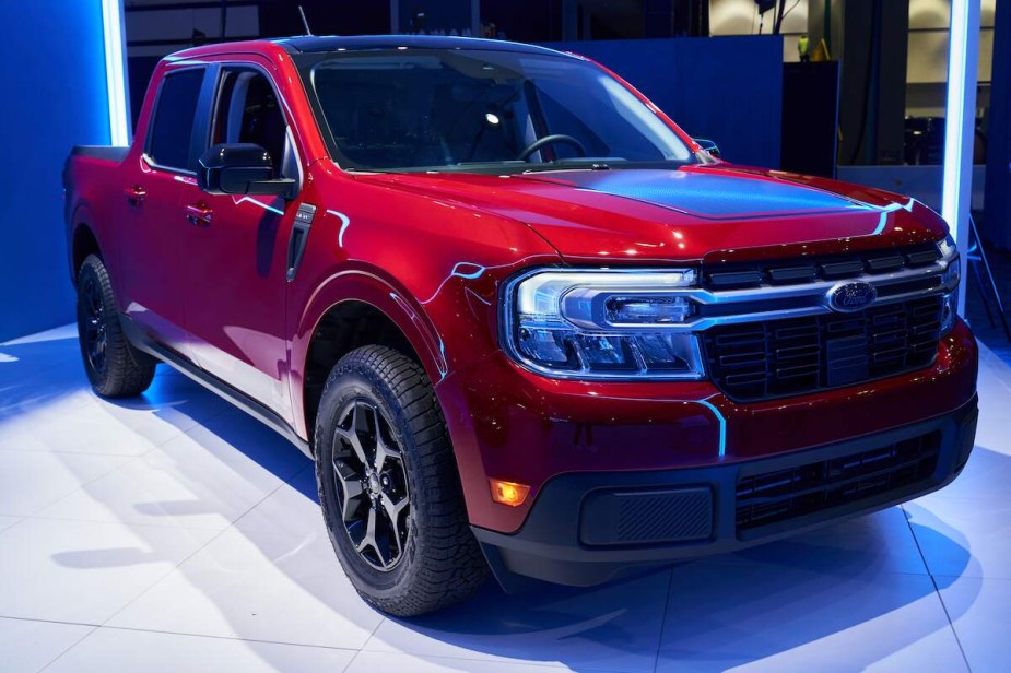 A red 2022 Ford Maverick parked indoors. 