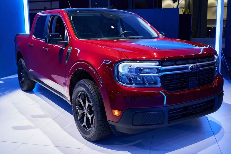 A red 2022 Ford Maverick parked indoors.