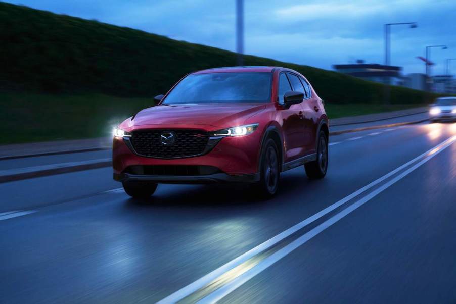 A red 2022 Mazda CX-5 driving down the road.