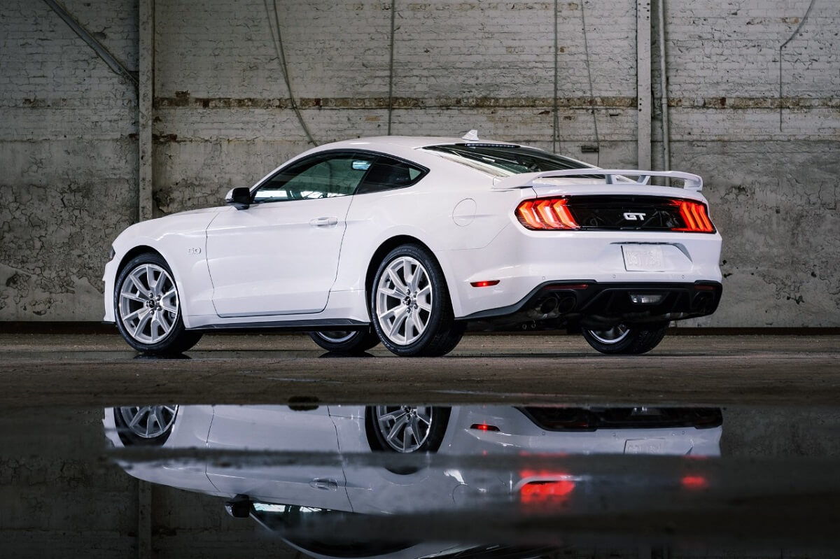 A pre-S650 S550 2023 Ford Mustang GT shows off its Ice White paint and rear-end styling.