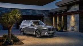 A 2023 BMW X7 parked in a driveway.