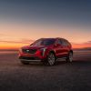 A red 2023 Cadillac XT4 at sunset