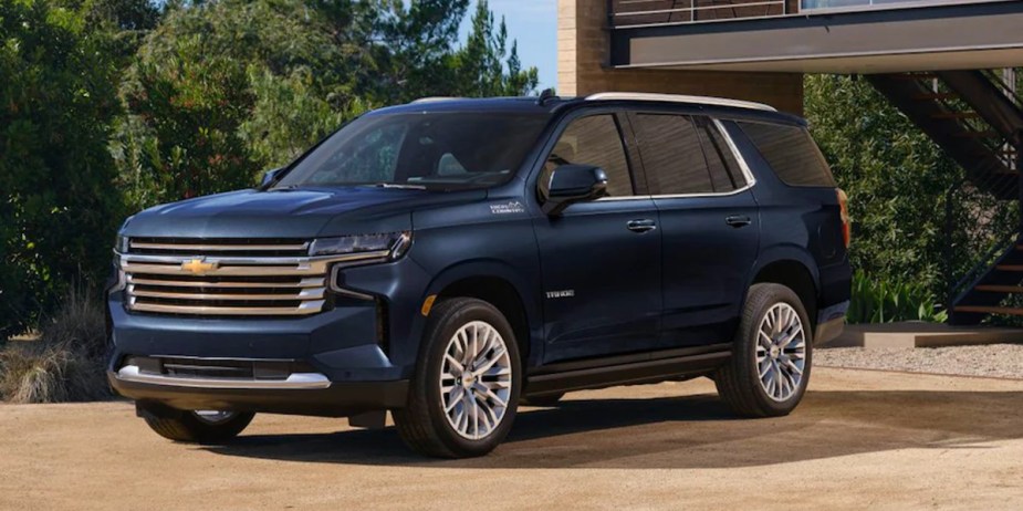 A blue 2023 Chevrolet Tahoe full-size SUV is parked. 