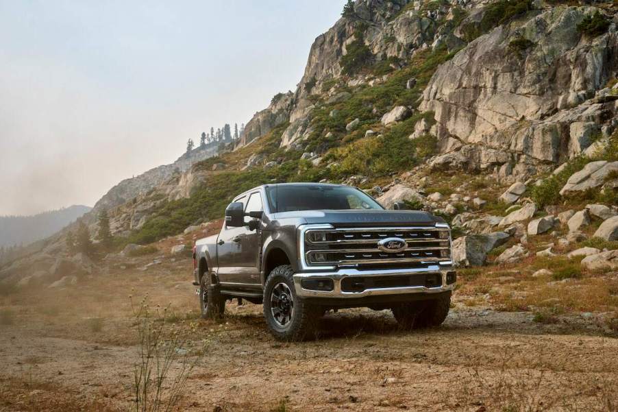 A 2023 Ford Super Duty F-250 driving in a rocky mountainous area. The F-250 is one of the best heavy duty trucks to buy.