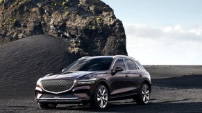 A black 2023 Genesis GV70 small luxury SUV.