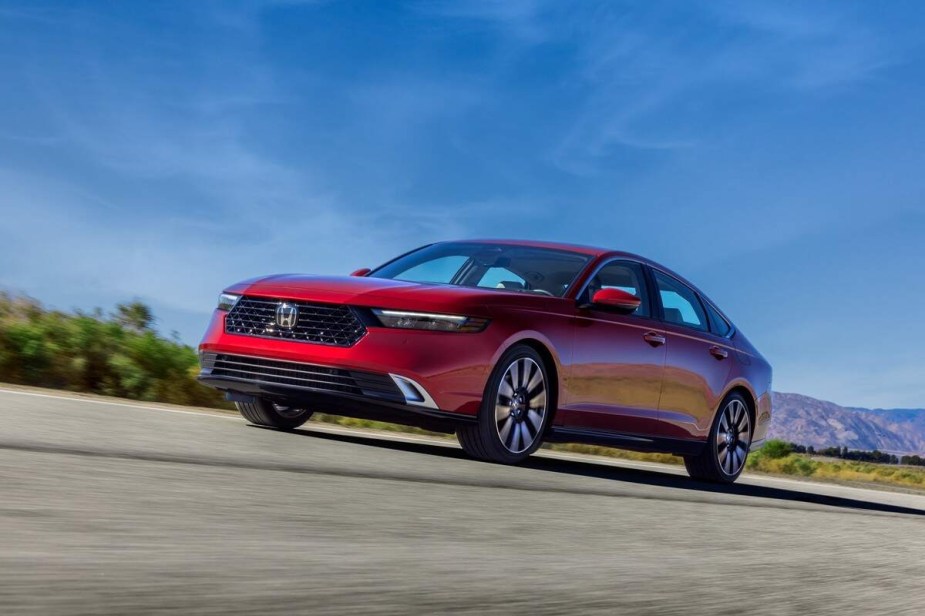 A red 2023 Honda Accord Touring parked outdoors. 