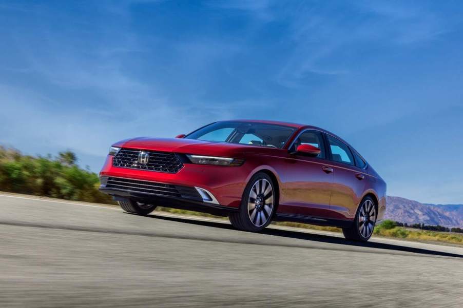 A red 2023 Honda Accord Touring parked outdoors.