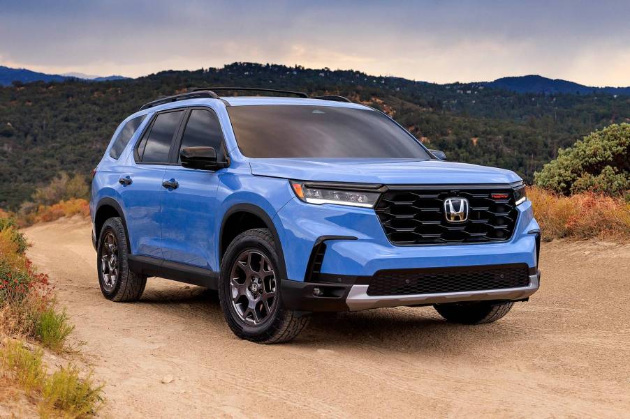 The 2023 Honda Pilot off-roading on a dirt trail