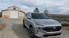 2023 Hyundai Santa Fe Calligraphy in front of a shed