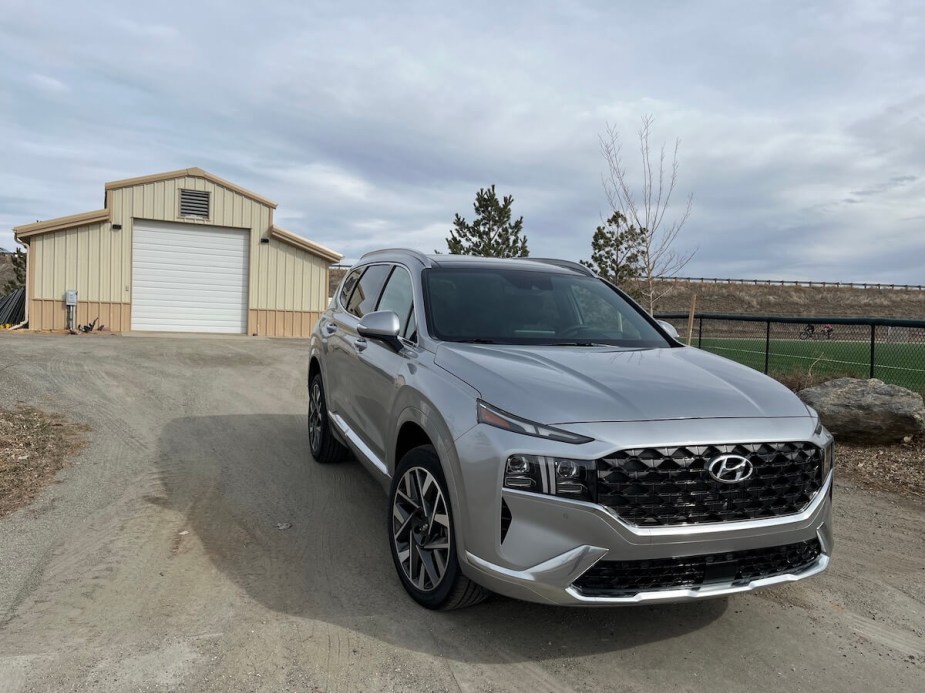 2023 Hyundai Santa Fe Calligraphy in front of a shed