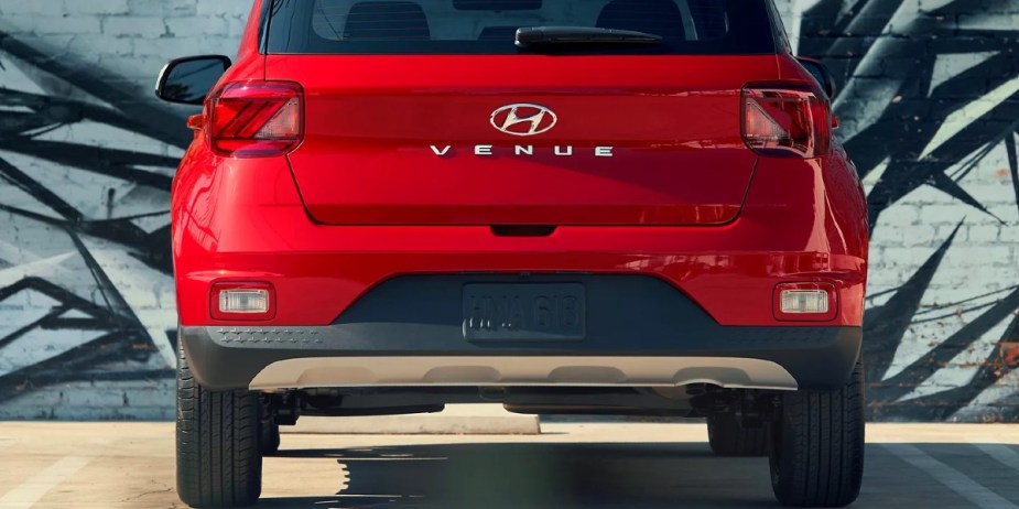 A red 2023 Hyundai Venue subcompact SUV is parked. 