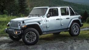 The 2023 Jeep Wrangler driving down the road