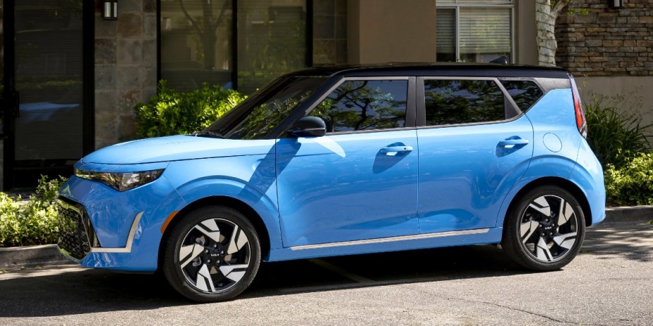 A blue 2023 Kia Soul subcompact SUV is parked. 