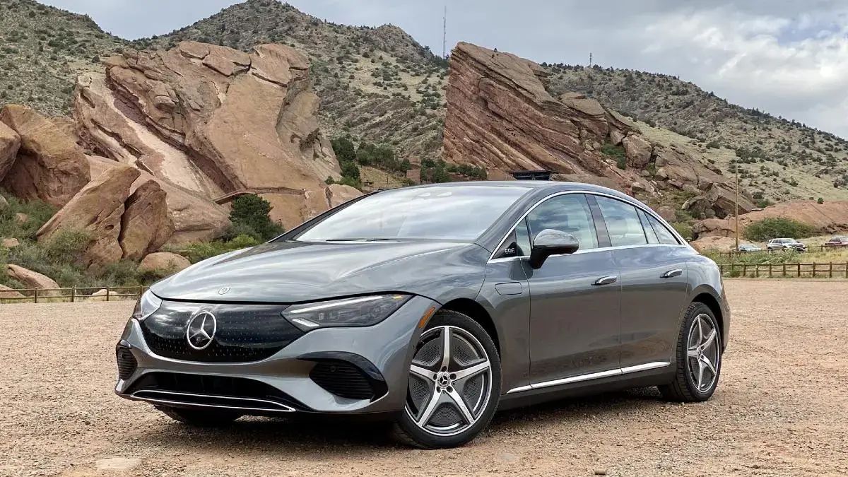 Mercedes EQE sedan parked on a desert highway