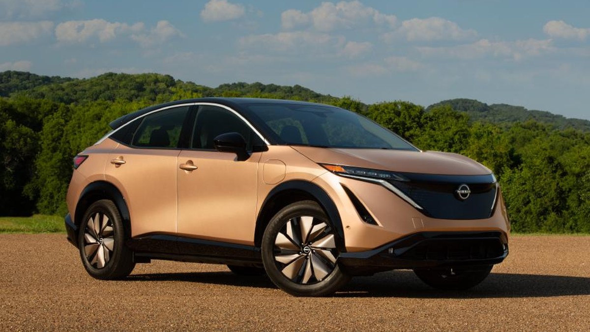 2023 Nissan Ariya on a Dirt Road with Greenery in the Background