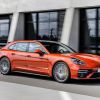 An orange Porsche Panamera Turbo S from the best luxury car brand of 2023