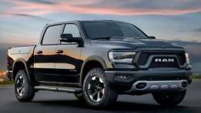 A black 2023 Ram 1500 parked at dusk