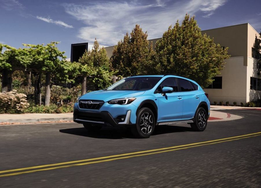 A safe, small 2023 Subaru Crosstrek shows off liftback car proportions with bright blue paintwork.