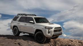 The 2023 Toyota 4Runner off-roading over rocks