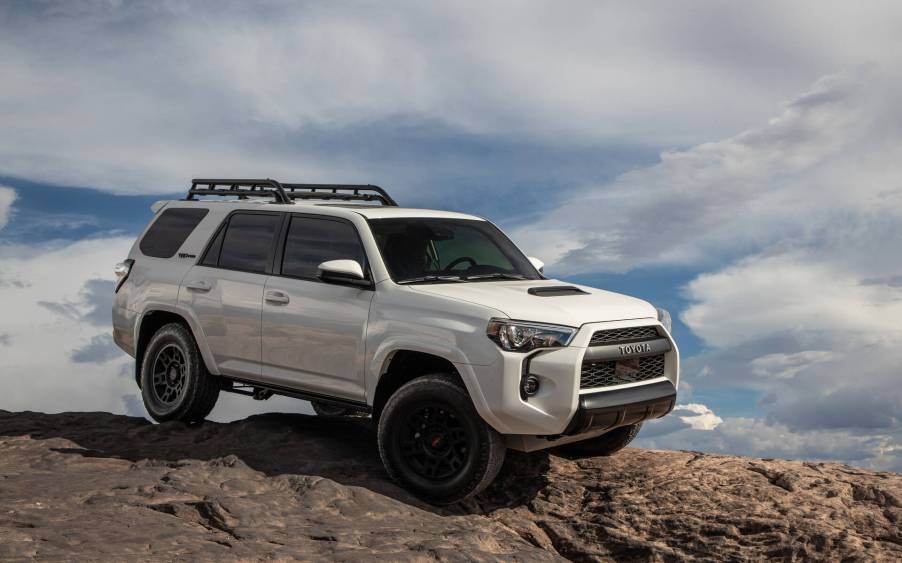 The 2023 Toyota 4Runner off-roading over rocks