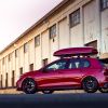 A red 2023 Volkswagen Golf GTI sport hatchback 'hot hatch' model with roof cargo carrier