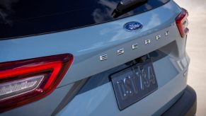 The rear lift gate of a 2023 Ford Escape PHEV in light blue.