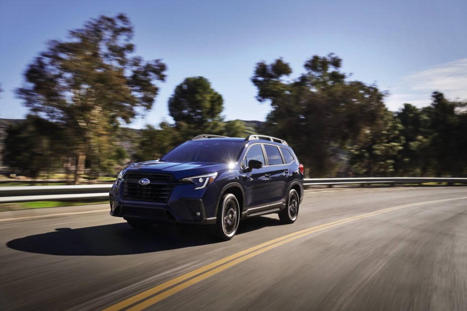 A new 2023 Subaru Ascent drives down a highway. 