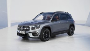 A silver 2024 Mercedes-Benz GLB with a white backdrop.