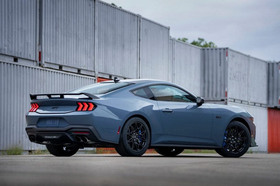 A blue 2024 Ford Mustang GT shows off its new looks and spoiler.